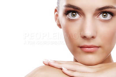 Buy stock photo Studio portrait of a beautiful young woman touching her face isolated on white