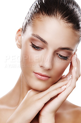 Buy stock photo Studio shot of a beautiful young woman touching her face isolated on white