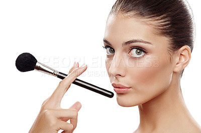Buy stock photo Beautiful woman applying make-up with a cosmetic brush