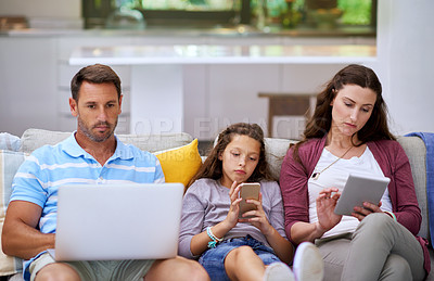 Buy stock photo Home, sofa and girl with technology by parents for communication, networking or online connection. Antisocial, family and tablet with phone and laptop for internet addiction, entertainment or problem