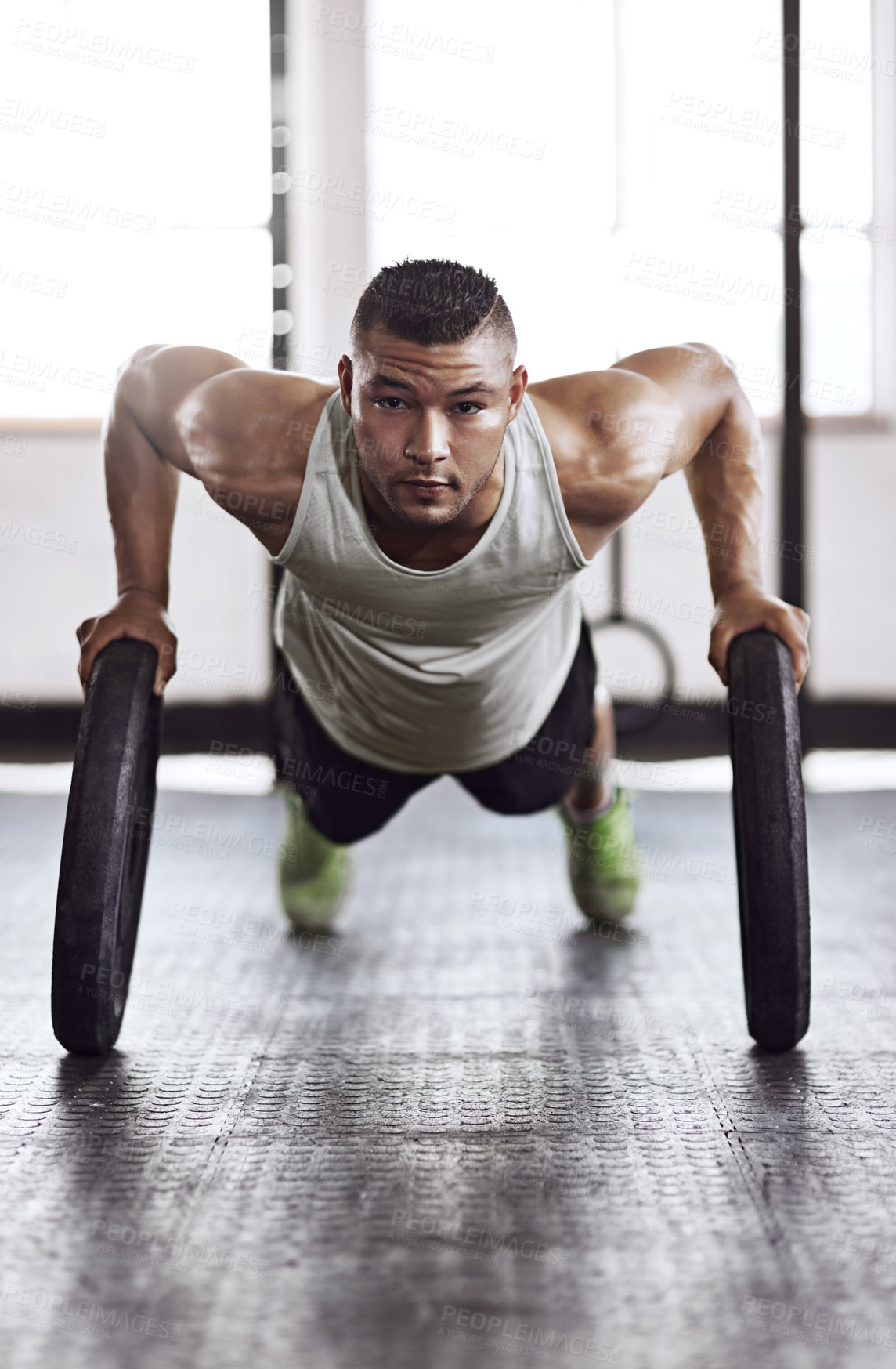 Buy stock photo Full length shot of a young man working out in the gym