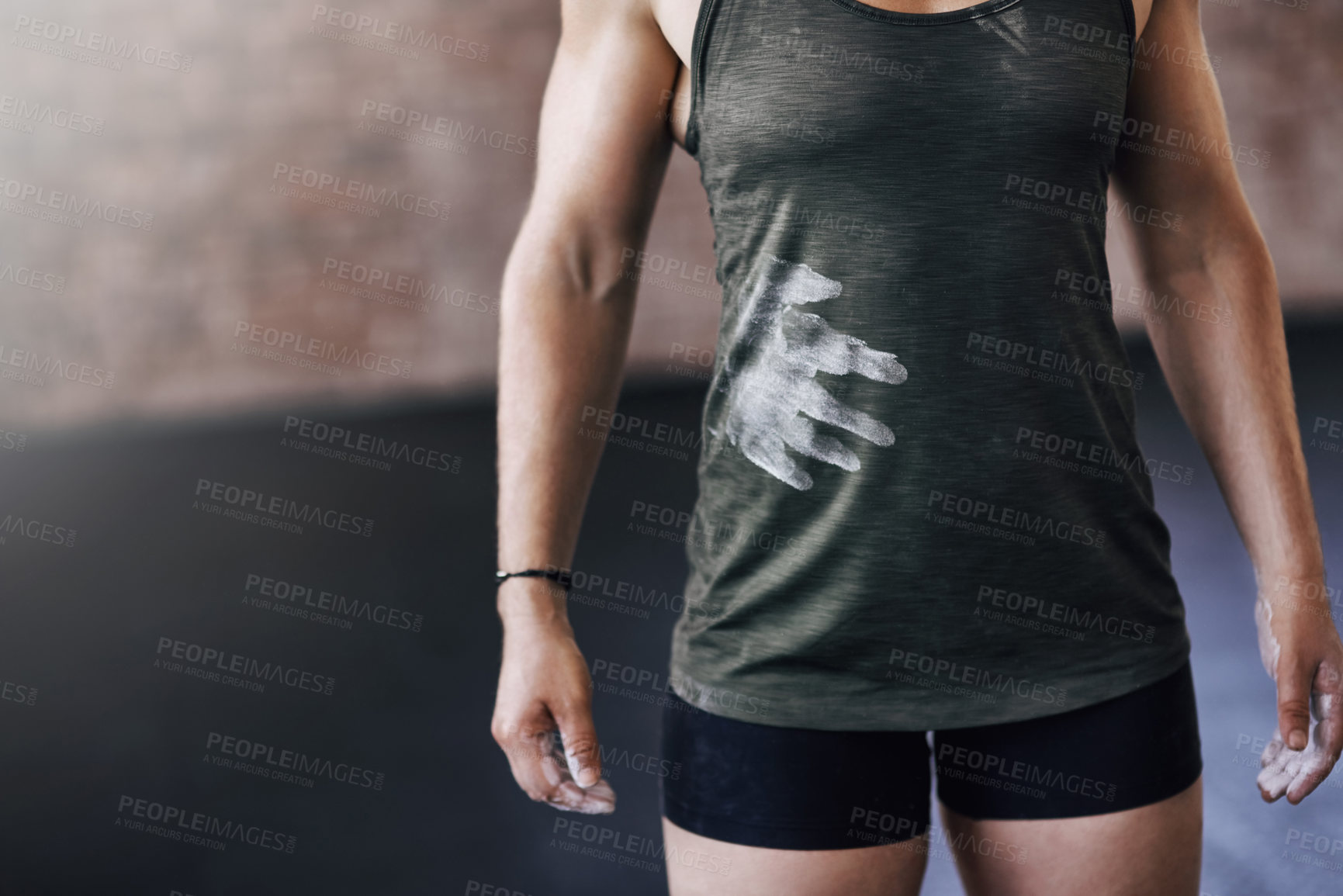 Buy stock photo Cropped shot of a young woman working out in the gym