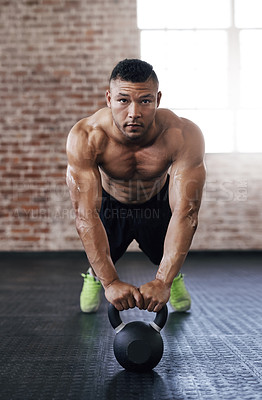 Buy stock photo Full length shot of a young man working out in the gym