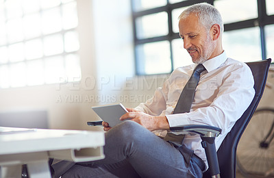 Buy stock photo Corporate, smile and tablet with business man in office for email communication, management or research. CEO, internet and technology with happy mature boss or employer reading info in workplace