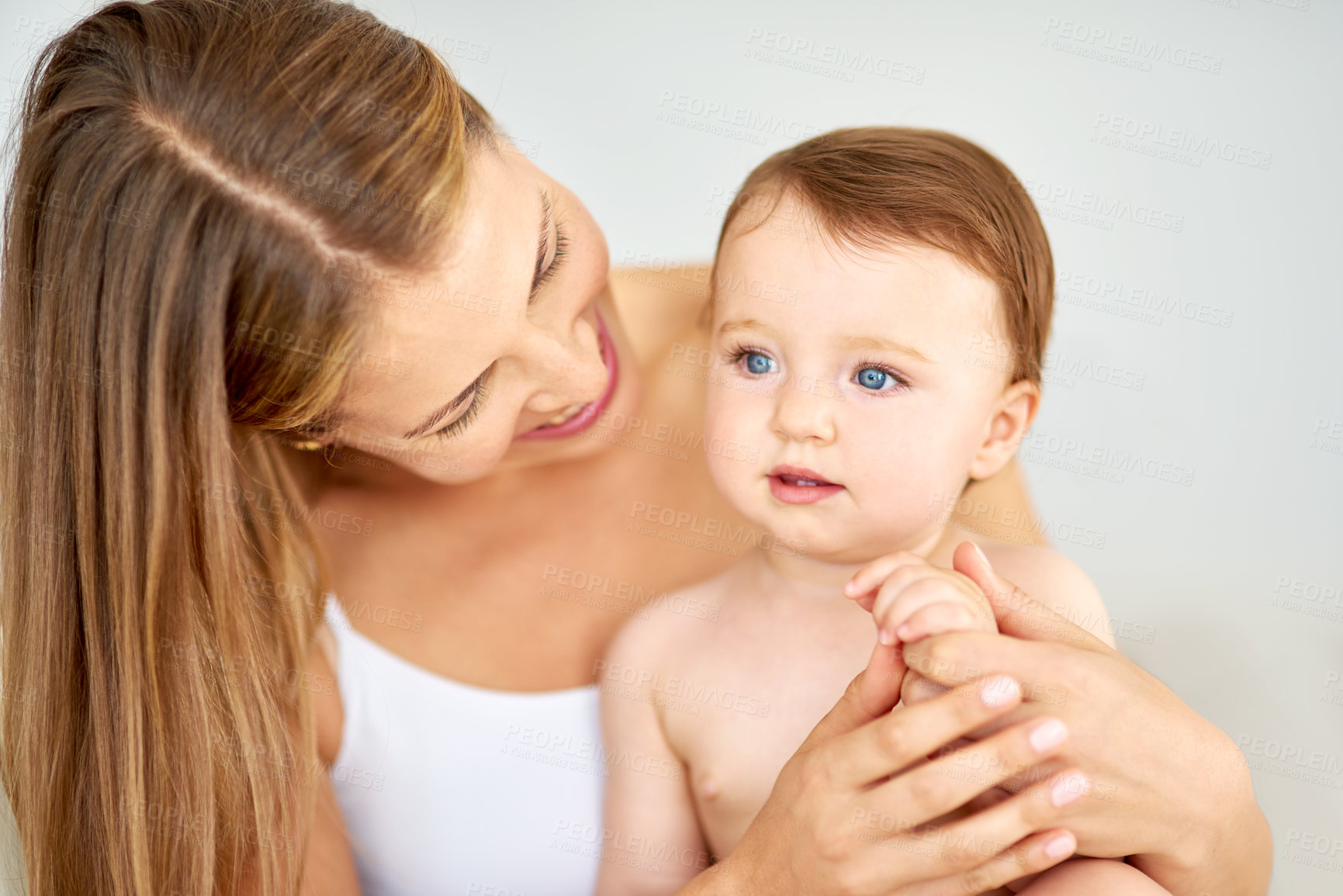 Buy stock photo Relax, happy and mother holding baby in diaper at home for safety, love and protection. Smile, care and young mom with cute toddler, kid or child for support and bonding together at family house.