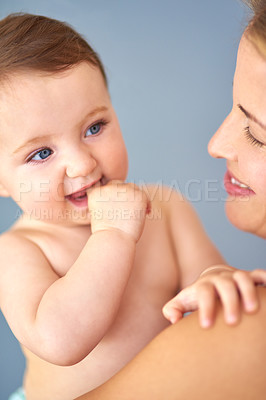 Buy stock photo Shot of a mother carrying her adorable baby girl