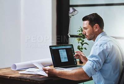 Buy stock photo Cropped shot of a businessman working on his laptop at home