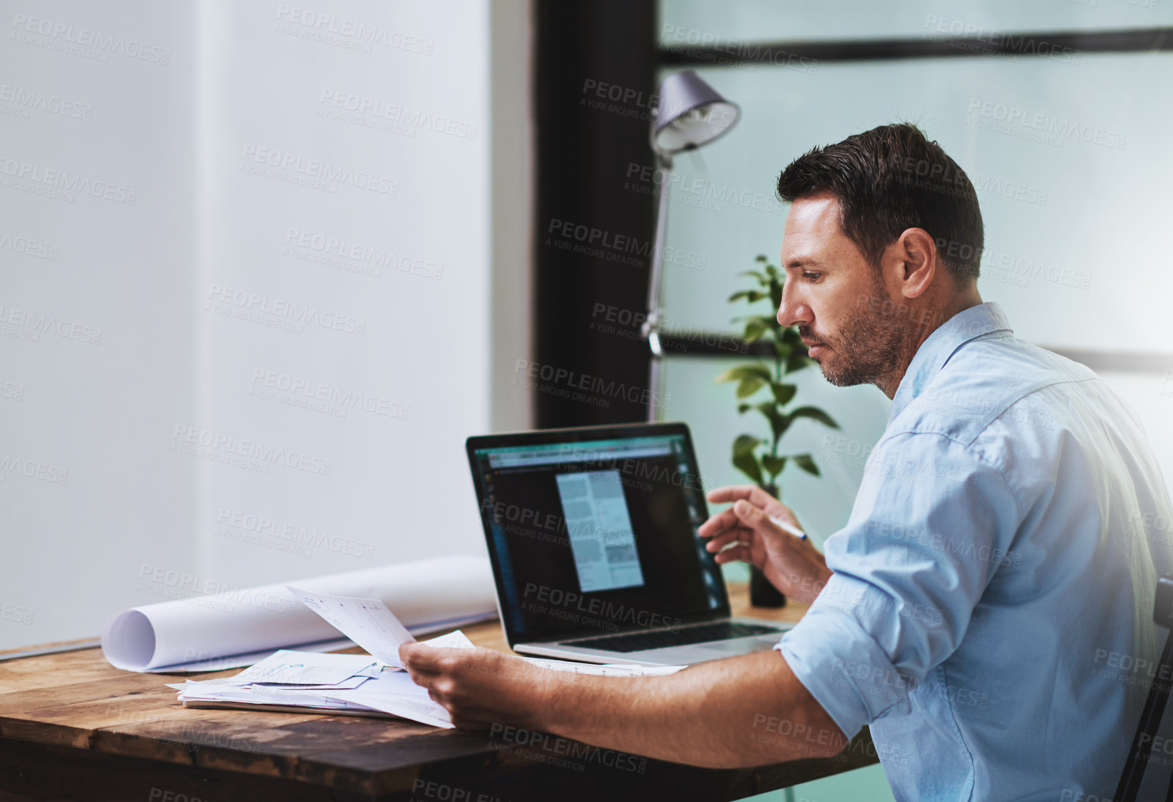 Buy stock photo Architect, planning and online with laptop for man, paperwork and email for research on building. Office, industrial property design for male person, construction and project manager with blueprint  