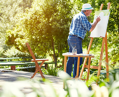 Buy stock photo Full length shot of a senior man painting in the park