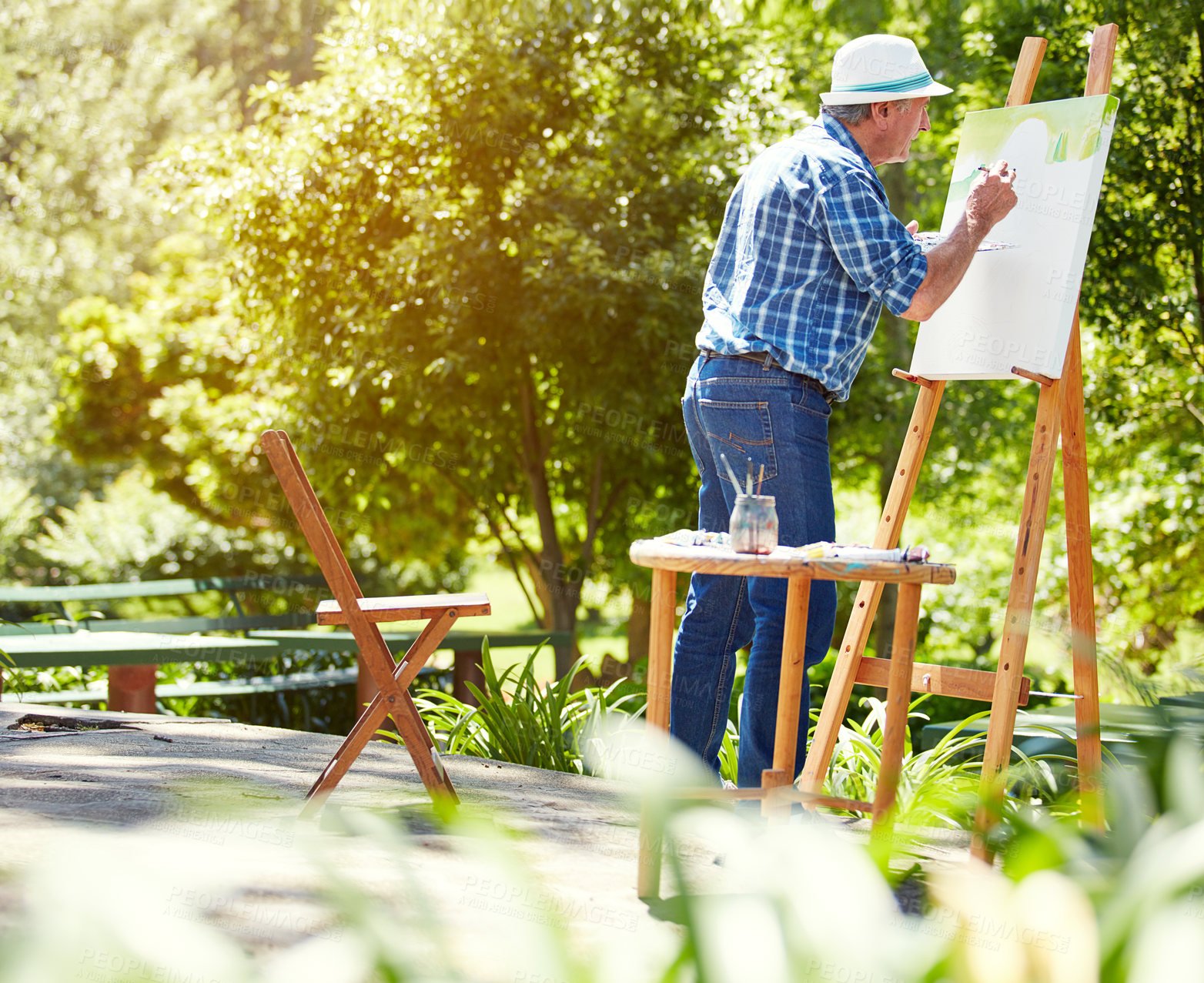 Buy stock photo Full length shot of a senior man painting in the park