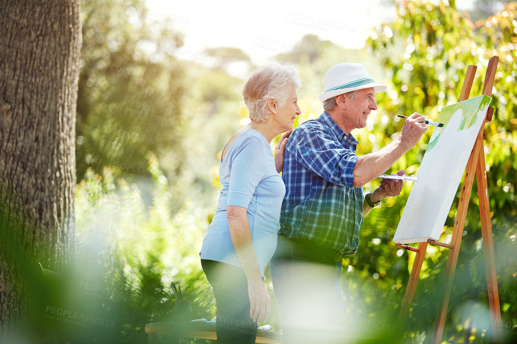 Buy stock photo Cropped shot of a senior couple painting in the park