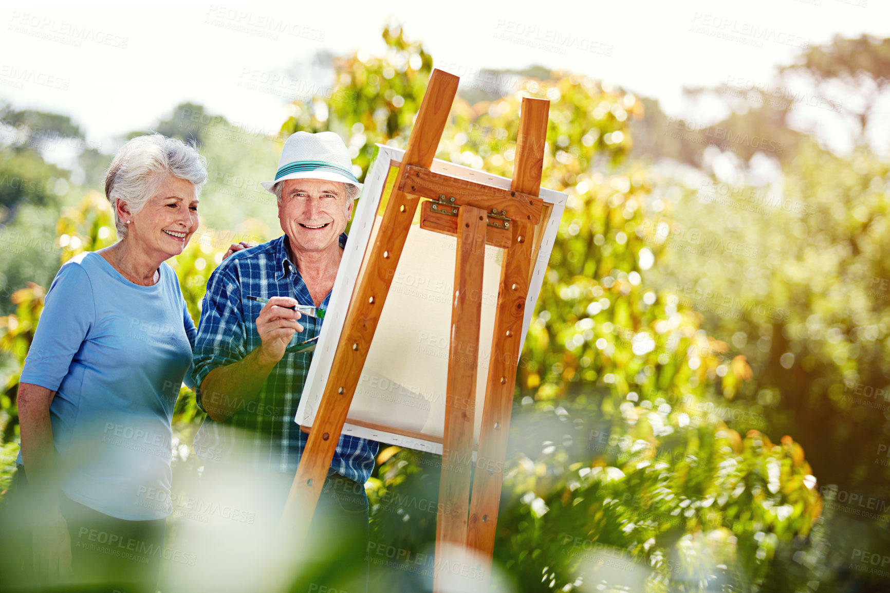 Buy stock photo Cropped shot of a senior couple painting in the park