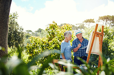 Buy stock photo Cropped shot of a senior couple painting in the park