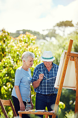 Buy stock photo Cropped shot of a senior couple painting in the park