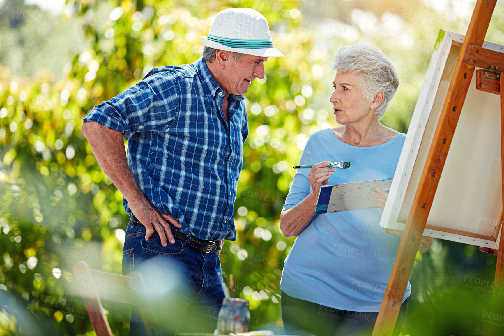 Buy stock photo Cropped shot of a senior couple painting in the park