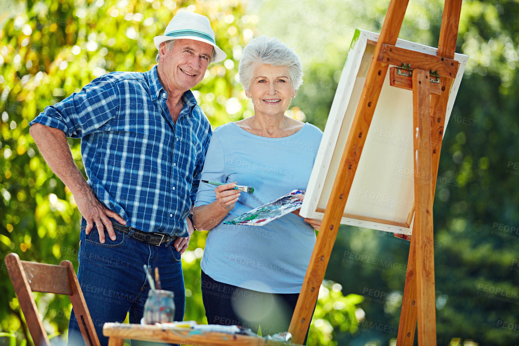 Buy stock photo Cropped portrait of a senior couple painting in the park