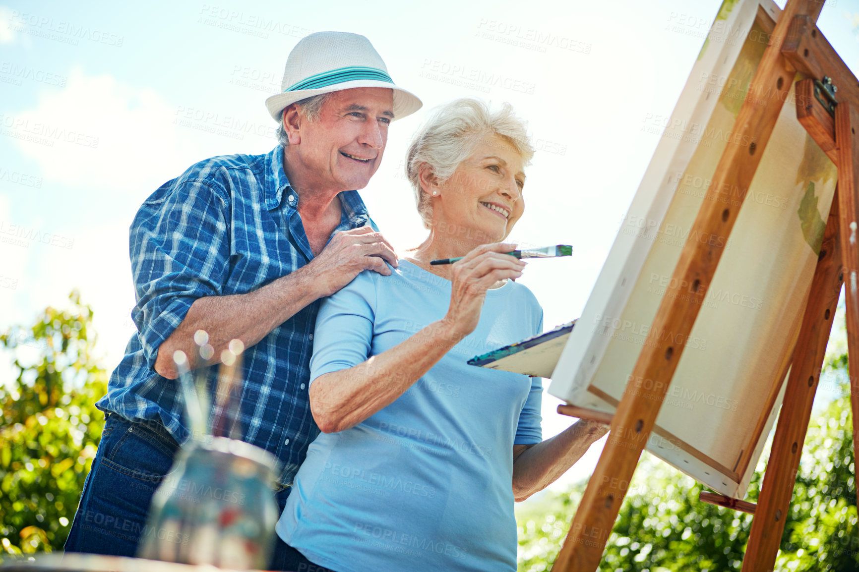 Buy stock photo Cropped shot of a senior couple painting in the park