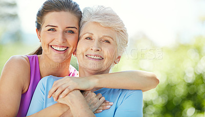 Buy stock photo Cropped portrait of a young woman and her mother in the park