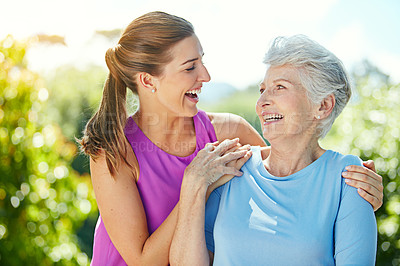 Buy stock photo Cropped shot of a young woman and her mother in the park