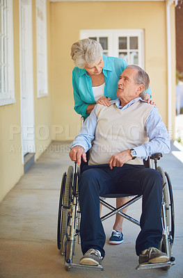 Buy stock photo Talking, old woman or senior man wheelchair in retirement or nursing home helping husband for support. Wellness, couple or elderly wife pushing a mature person with a disability in house or clinic