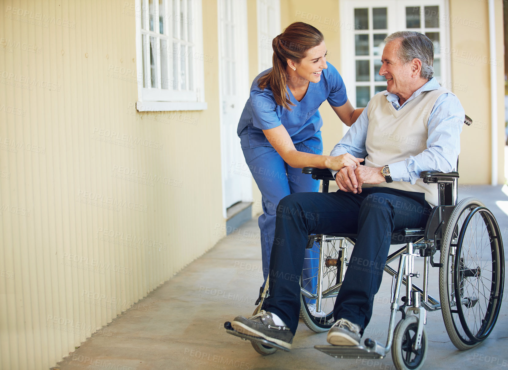 Buy stock photo Talking, happy caregiver or old man in wheelchair in hospital helping an elderly patient for support in clinic. Medical nurse or healthcare social worker speaking to a senior person with disability 