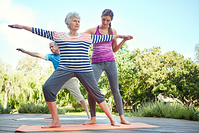 Buy stock photo Nature, elderly people and yoga coach, woman or personal trainer teaching exercise, outdoor workout or fitness. Instructor, wellness couple and old person learning pilates, training or health balance