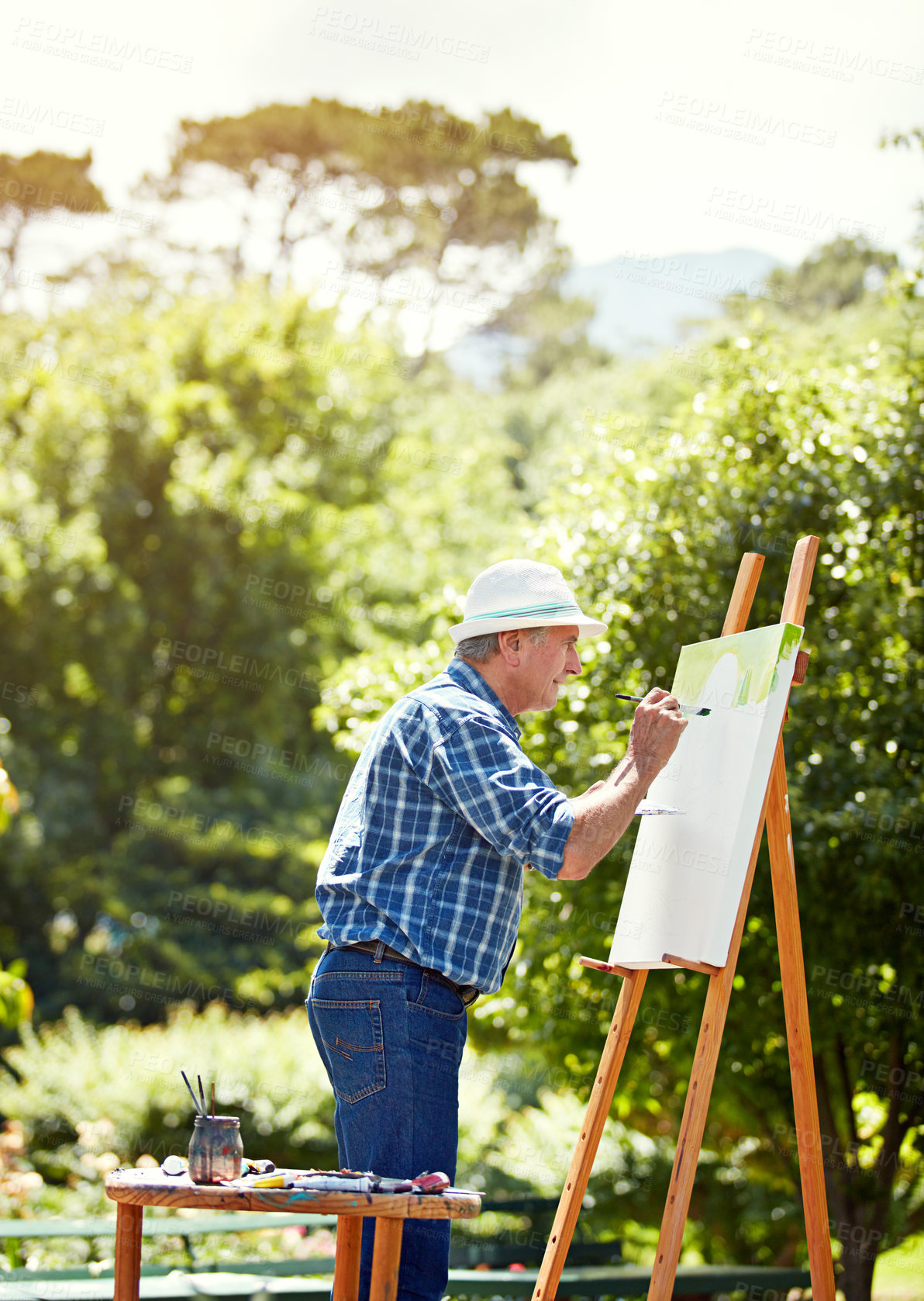 Buy stock photo Cropped shot of a senior man painting in the park