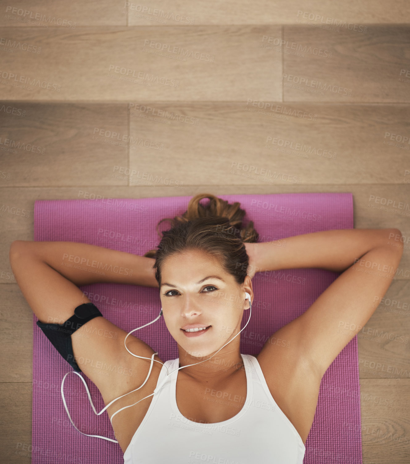 Buy stock photo Woman, portrait and listening to music on yoga mat with peace for health, wellness and exercise. Happy face of young person with audio streaming or podcast on break, relax or rest on floor above