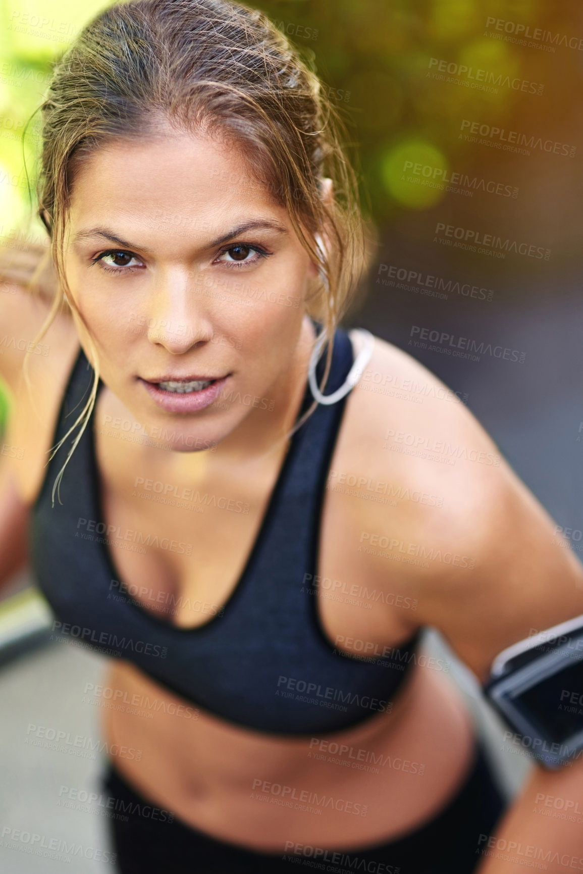 Buy stock photo Cropped portrait of an attractive young athlete exercising outdoors