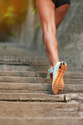 Buy stock photo Rearview shot of a young female athlete exercising outdoors