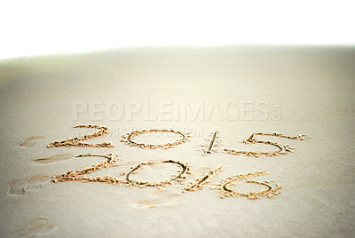 Buy stock photo Shot of the years 2015 and 2016 written in sand