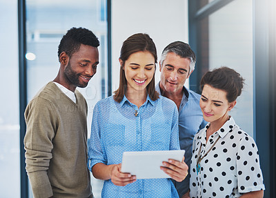 Buy stock photo Cropped shot of a group of businesspeople working in the office