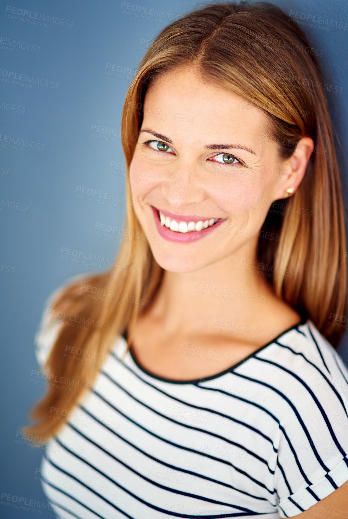 Buy stock photo Woman, smile and portrait in studio with fashion, confidence and pride with edgy style by blue background. Excited person, model and happy with clothes, tshirt and trendy outfit in New Zealand