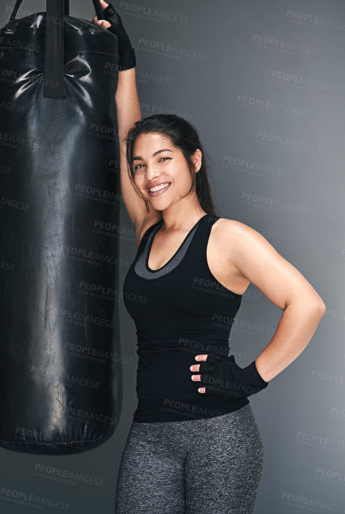 Buy stock photo Studio shot of a female kickboxer against a gray background