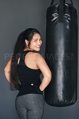 Buy stock photo Studio shot of a female kickboxer against a gray background