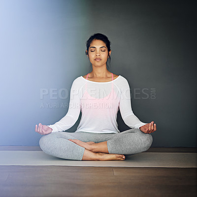 Buy stock photo Shot of an attractive young woman doing yoga
