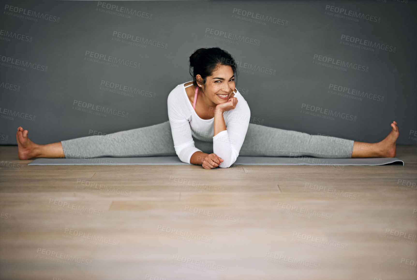 Buy stock photo Woman, house and portrait for legs splits, pilates and wall background for body wellness with relaxing smile. Happy, flexibility training and stretching on mat, contortion and balance activity