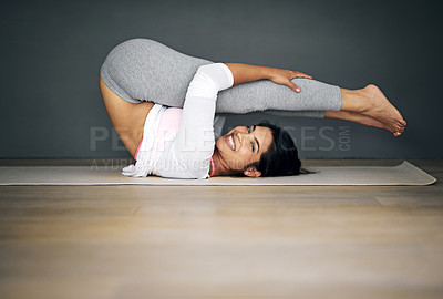Buy stock photo Portrait of a flexible young woman doing yoga
