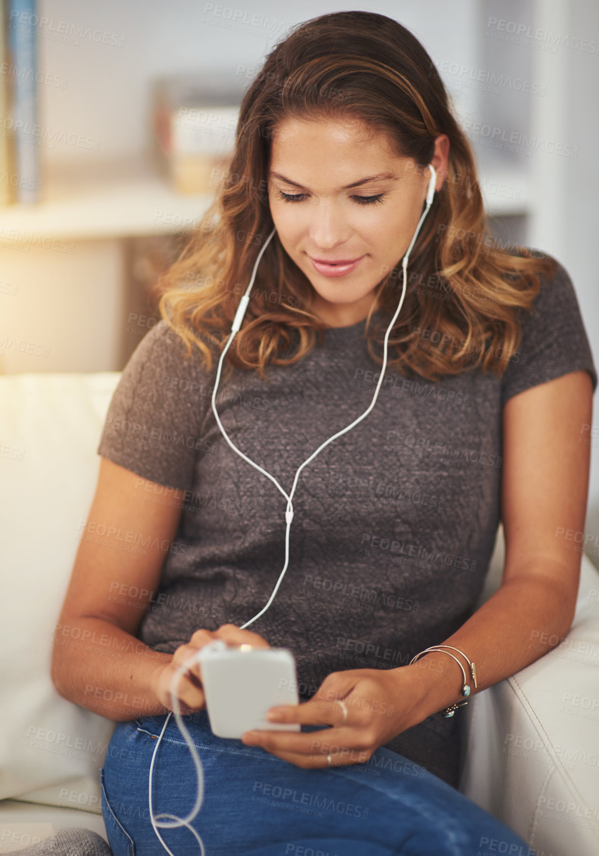 Buy stock photo Woman, earphones and streaming music on couch, communication and scroll on social media in home. Female person, phone and search movie platform for entertainment, ebook and app for sound or audio