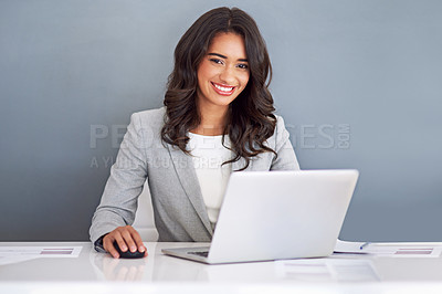 Buy stock photo Cropped portrait of a young businesswoman working on her laptop