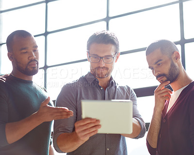 Buy stock photo Cropped shot of a group of coworkers standing in the boardroom