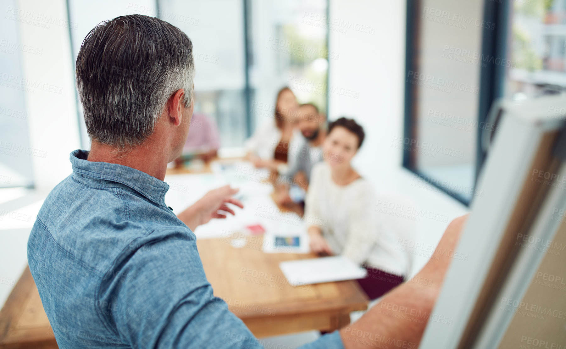 Buy stock photo Shot of a group of colleagues having a presentation at work