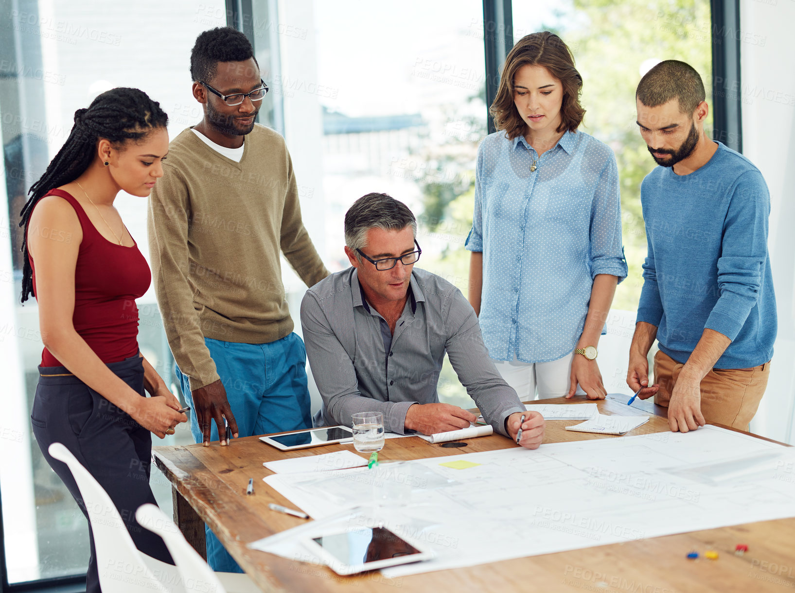 Buy stock photo Cropped shot of a group of architects in the boardroom