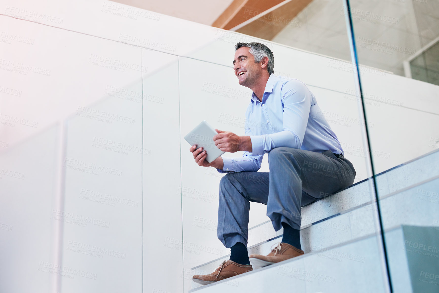 Buy stock photo Business, man and happy in stairs with tablet on break for social media post and interaction. Male person, employee and mature or laughing at office with online videos, memes and communication