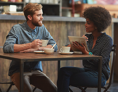 Buy stock photo Smile, man and woman in coffee shop with tablet, social media, relax and networking connection at table. Date, weekend conversation and happy couple in cafe with digital app, drink and online search