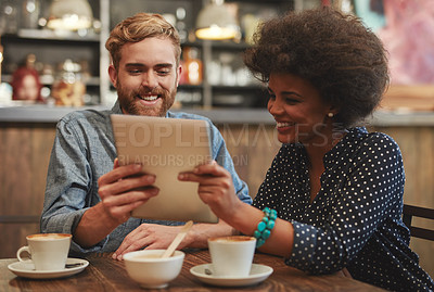 Buy stock photo Couple, tablet and laughing on date in coffee shop with social media meme, bonding and funny online information. Interracial, people and happy in cafe with tech app for comic post update and relax