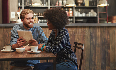 Buy stock photo Couple, tablet and laughing or happy in cafe with social media meme, bonding and funny online information. Interracial, people and smile in coffee shop with tech for comic post update or mockup space