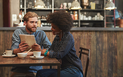 Buy stock photo Couple, tablet and laughing or smile in cafe with social media meme, bonding and funny online information. Interracial, people and happy in coffee shop with tech for comic post update or mockup space