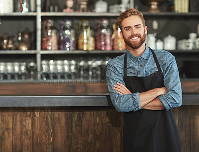 Buy stock photo Confidence, industry and portrait of male barista standing by the counter in his startup cafeteria. Smile, success and young man with crossed arms with a small business coffee shop or restaurant.