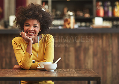 Buy stock photo Portrait of a young woman having coffee at a cafe
